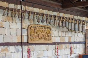 a stone wall with a wooden plaque on it at Любомировата къща in Sredni Kolibi +32 photos