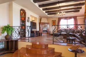 a living room with a table and a dining room at Любомировата къща in Sredni Kolibi