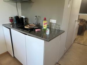 a small kitchen with a counter top with a counter top at Thistedvej 40 in Nørresundby