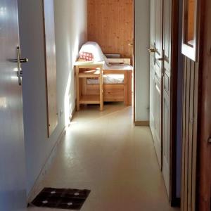 a hallway with a desk in a room at Studio plein sud avec piscine in Saint-Jean-dʼArves