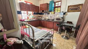 a kitchen with a bunk bed in a room at Cassa Bonda Single Studio in Kampong Bakat