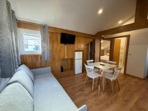 a living room with a couch and a table at Porta 4 City Flat in Vila Real