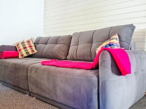 a brown couch with two pillows on it at Apartment Loidl by Interhome in Ebensee