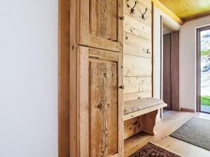 a wooden wall with a bench in a room at Apartment Loidl by Interhome in Ebensee +34 photos