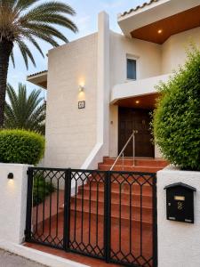 a house with a gate in front of it at Mini Studio N6 private Bathroom and Kitchenette in Limassol