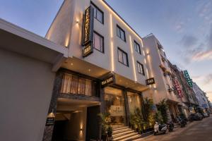 a building on the side of a street at Hotel Loft Near IGI Airport Delhi in New Delhi