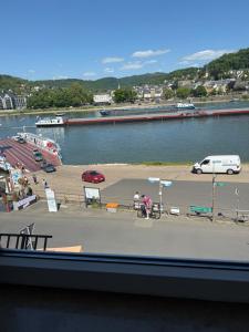 a view of a parking lot and a body of water at Rheinblick Appartements in Remagen