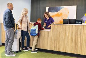 a group of people standing around a reception desk at Spark By Hilton Staunton in Staunton +67 photos