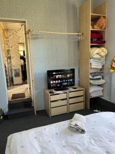 a hospital room with a bed and a mirror at Atpūtas vieta ar pirti, with wi-fi, self check in and private parking in Ventspils +28 photos