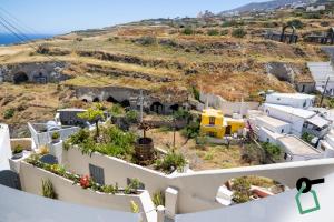 a view from the balcony of a house at Hotiday Santorini Mesaria in Fira