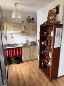 a kitchen with a stove and a refrigerator at Pokoje Przy Szlaku Agroturystyka in Żabnica +22 photos