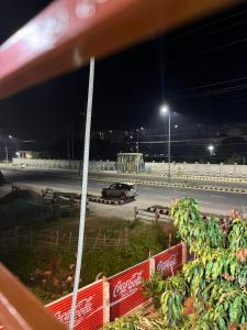 a car driving on a highway at night at Hotel Diyo inn in Guwahati