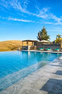 a swimming pool in the middle of a field at Kaha Lak in Douar Aguergour