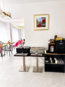 a living room with a table with some food at Rosetti Inn in Cluj-Napoca