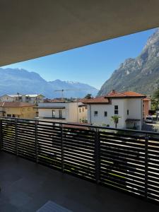 a view from a balcony of buildings and mountains at GardaBreak Rooms&Breakfast Holiday Apartments in Riva del Garda