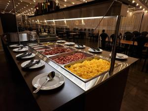 a buffet line with many different types of food at Hotel Hvolsvollur - Central South Iceland in Hvolsvöllur