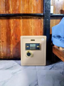an old washing machine sitting on the floor at Lake side villa in Ko Phangan