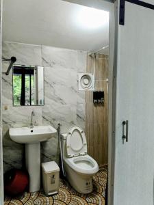 a bathroom with a toilet and a sink at Lake side villa in Ko Phangan +29 photos