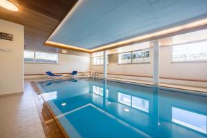 a swimming pool in a house at New Exclusive Studio with eFireplace, Pool & Sauna in St. Moritz