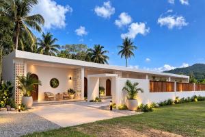 a rendering of a house with palm trees at Meena boutique in Ban Nai Wat