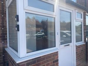 a window on the side of a brick house at London Heathrow Hayes Escape in South Ruislip Station