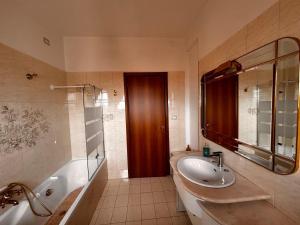a bathroom with a sink and a tub and a shower at La Casa del Benessere in Campobasso +37 photos