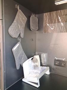 a bathroom with a white washing machine and towels at Fonso's Garden in Freudenstadt +31 photos