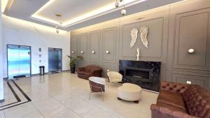 a living room with couches and a fireplace at TORREMIA apartamentos de lujo in Cochabamba
