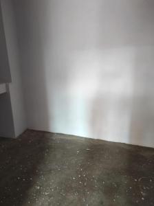 an empty room with a concrete floor and white walls at Bhati Bhawan in Bārmer