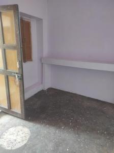 an empty room with a door and a window at Bhati Bhawan in Bārmer