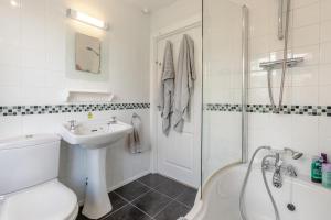 a bathroom with a sink and a toilet and a shower at 2 Bed in Looe oc-l30026 in Looe +30 photos