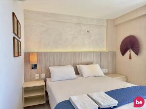 a bedroom with a bed with two towels on it at Condomínio Mediterranee Residence por Be My Guest in Aquiraz +287 photos