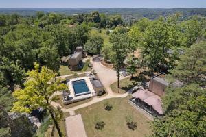 an aerial view of a house with a swimming pool at Le Pech Eternel - La Truffière in Sarlat-la-Canéda +16 photos