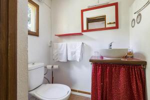 a bathroom with a toilet and a sink at Gite Insolite Mas Boutet in Argelès-sur-Mer