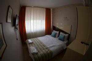 Postel nebo postele na pokoji v ubytování Ottoman Time Hotel