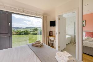 a bedroom with a bed and a large window at 2 Bed in Newburgh oc-g32594 in Newburgh