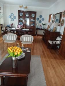 a living room with a table with fruit on it at Casa Rural in Esposende