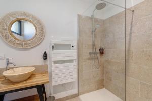 a bathroom with a shower and a sink and a mirror at Le Pech Eternel - La Sablière in Sarlat-la-Canéda +15 photos