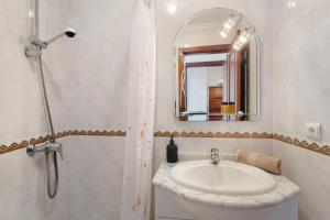 a bathroom with a sink and a mirror at Paradise Dream in Caniço +12 photos