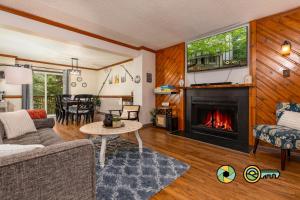a living room with a couch and a fireplace at Lakeview 10B: Forest Den in Basye