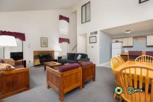 a living room with a couch and a table at Senedo Springs Duplex #90A in Basye