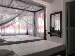 Letto o letti in una camera di Hotel Blue Sky