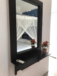 Letto o letti in una camera di Hotel Blue Sky