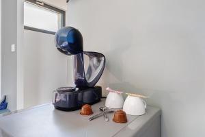 a blue blender sitting on top of a counter at Le Pech Eternel - La Sablière in Sarlat-la-Canéda