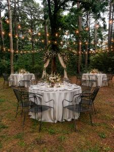 a table set up for a wedding with lights at Forest Springs Resort in Eureka Springs