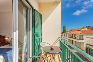 a balcony with a table and a view of a city at Paradise Dream in Caniço