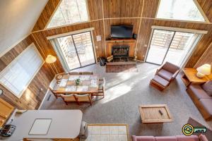 an overhead view of a living room with furniture and a television at Villa #162 in Basye