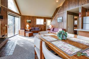 a living room with a table and chairs at Villa #162 in Basye