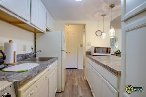a kitchen with a sink and a microwave at Aspen East Unit #122 in Basye