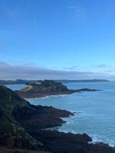 an island in the ocean with a house on it at Studio pour 1 ou 2 personnes in Le Landreau